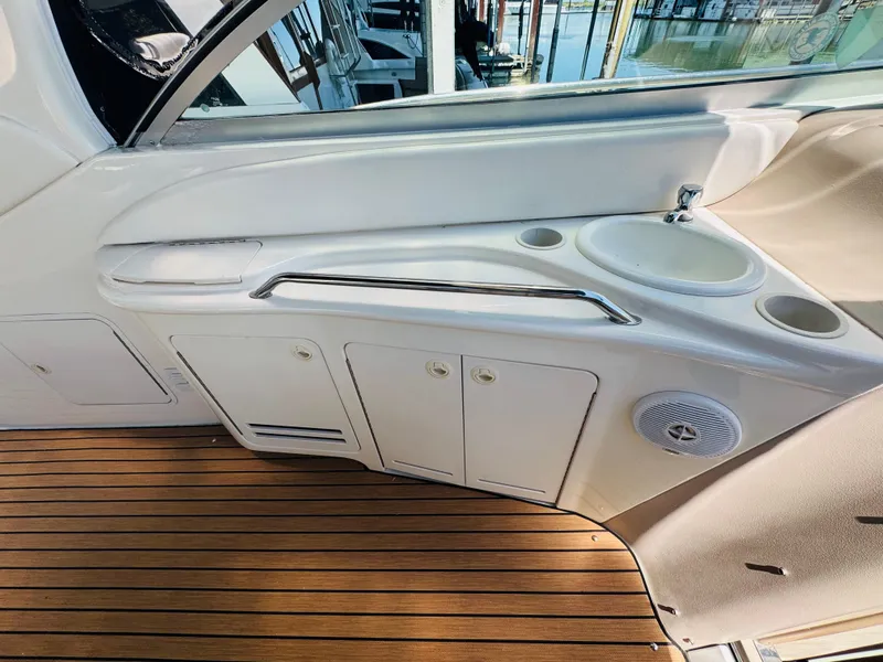 Slide: The Image of Interior view of 2000 Sea Ray 340 Sundancer with sink and storage cabinets. - 12