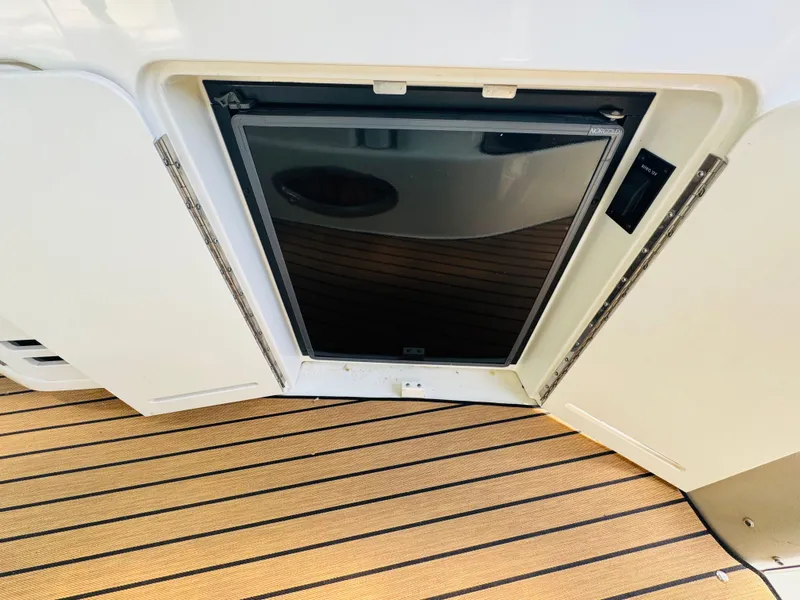 Slide: The Image of Built-in refrigerator on 2000 Sea Ray 340 Sundancer yacht, with teak flooring. - 13