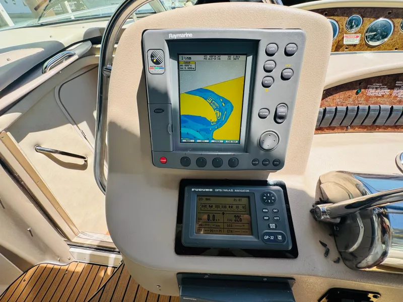 Slide: The Image of Control panel of a 2000 Sea Ray 340 Sundancer with navigation equipment. - 18