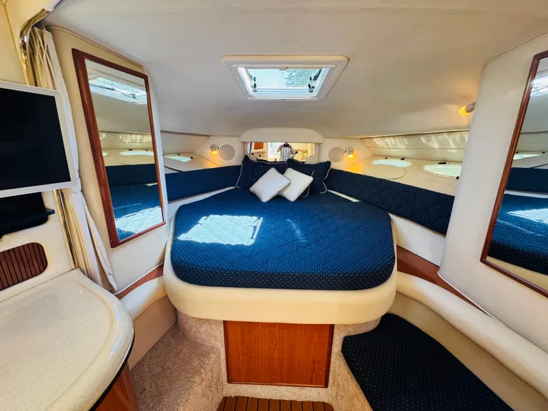 Slide: The Image of Interior of 2000 Sea Ray 340 Sundancer with cozy bed and modern amenities. - 23