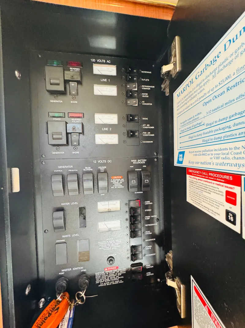 Slide: The Image of Electrical panel inside a 2000 Sea Ray 340 Sundancer boat. - 34