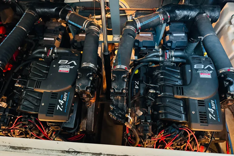 Slide: The Image of Twin V8 engines in a 2000 Sea Ray 340 Sundancer boat. - 36