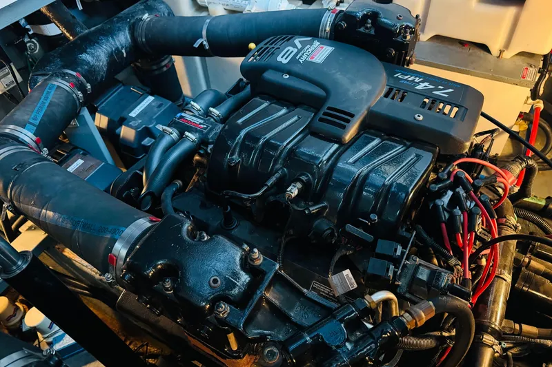 Slide: The Image of Engine of a 2000 Sea Ray 340 Sundancer boat, featuring a powerful V8 configuration. - 38