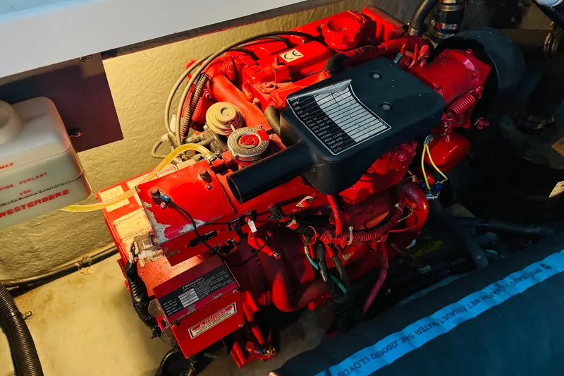 Slide: The Image of Engine compartment of a 2000 Sea Ray 340 Sundancer, featuring a red marine engine. - 39
