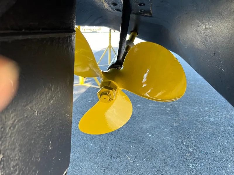 Slide: The Image of Yellow propeller of a 2000 Sea Ray 340 Sundancer boat on dry dock. - 41