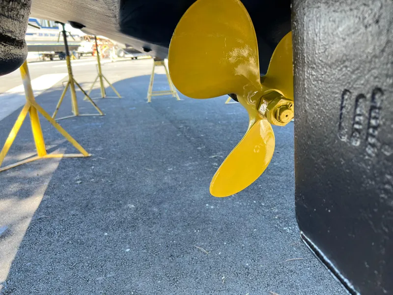 Slide: The Image of Yellow propeller of a 2000 Sea Ray 340 Sundancer on dry dock. - 42