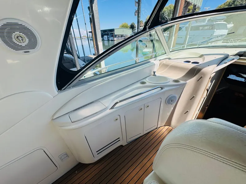 Slide: The Image of Interior of 2000 Sea Ray 340 Sundancer yacht with sleek design and wooden flooring. - 9