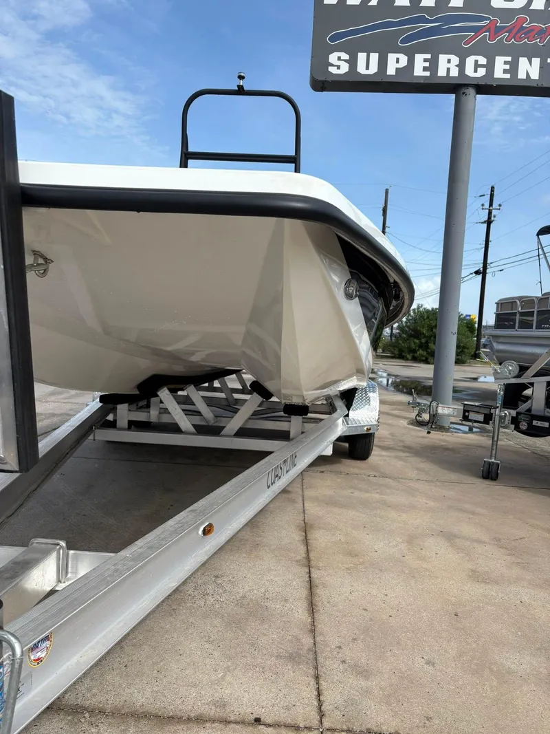 Slide: The Image of 2026 Freedom Boats USA 23' Warrior on trailer at dealership. - 10