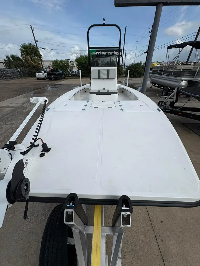 Slide: The Image of 2026 Freedom Boats USA 23' Warrior on trailer, parked outdoors. - 11