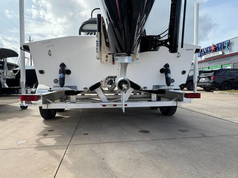 Slide: The Image of 2026 Freedom Boats USA 23' Warrior on trailer, rear view at dealership. - 13