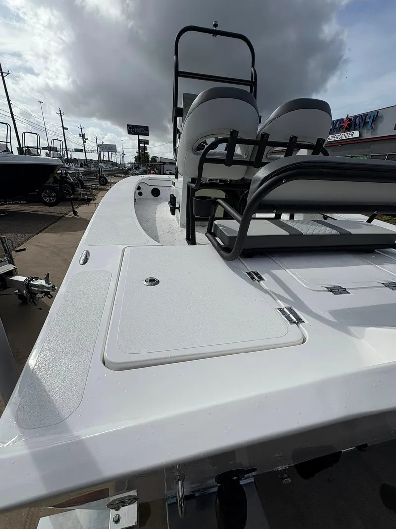 Slide: The Image of 2026 Freedom Boats USA 23' Warrior, white deck, dual seats, overcast sky. - 15