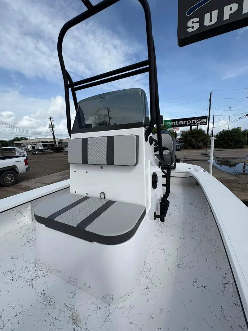 Slide: The Image of 2026 Freedom Boats USA 23' Warrior, white interior, outdoor display, overcast sky. - 20