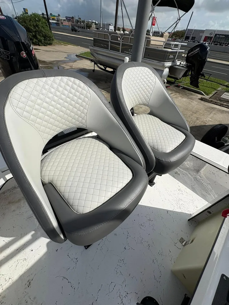 Slide: The Image of Two cushioned seats on a 2026 Freedom Boats USA 23' Warrior. - 21