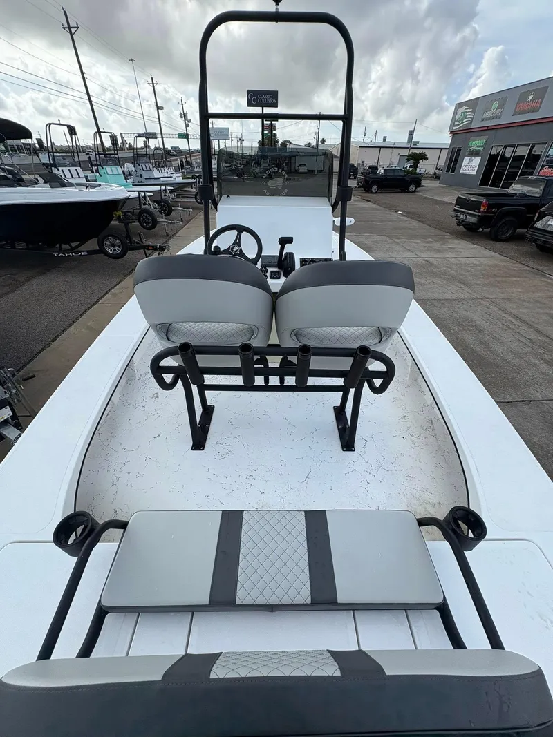 Slide: The Image of 2026 Freedom Boats USA 23' Warrior, sleek design, dual seats, outdoor showroom display. - 5
