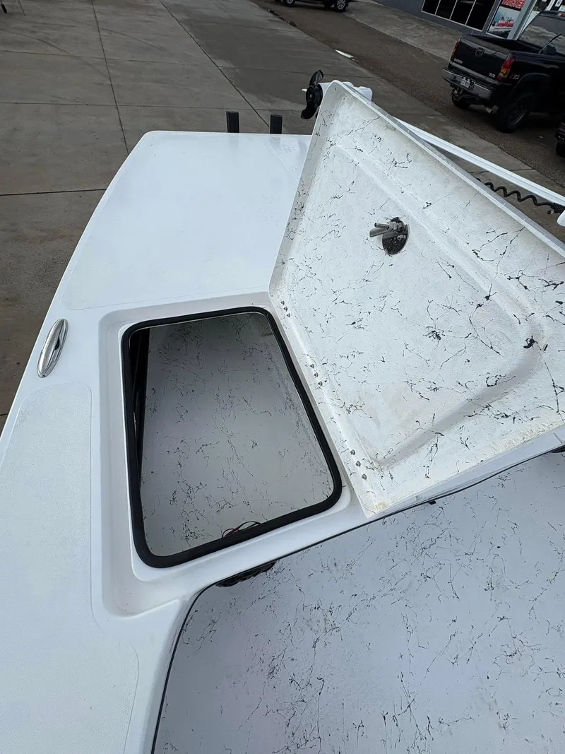 Slide: The Image of Open storage compartment on 2026 Freedom Boats USA 23' Warrior deck. - 6