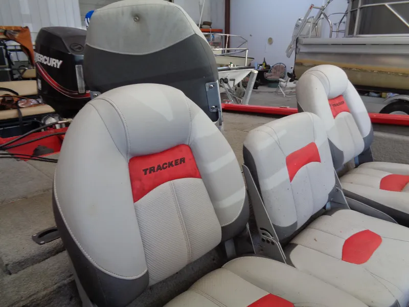 Slide: The Image of 2008 Bass Tracker PT175 boat seats with red accents and Mercury outboard motor. - 13