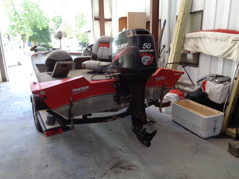Slide: The Image of 2008 Bass Tracker PT175 boat with Mercury 50 engine in a garage setting. - 3