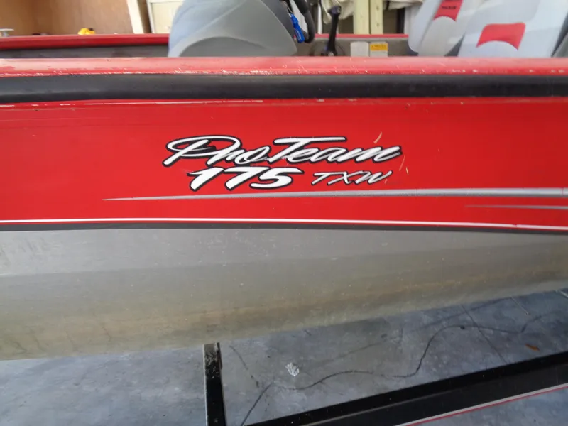 Slide: The Image of 2008 Bass Tracker PT175 boat, red exterior with "Pro Team 175 TXW" logo. - 8