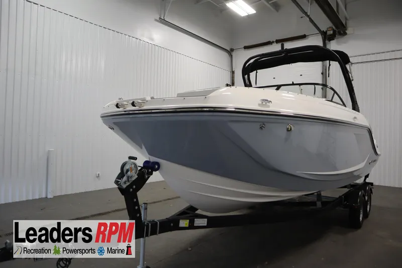 The Image of 2025 Bayliner D22I boat on trailer in indoor showroom. - 0