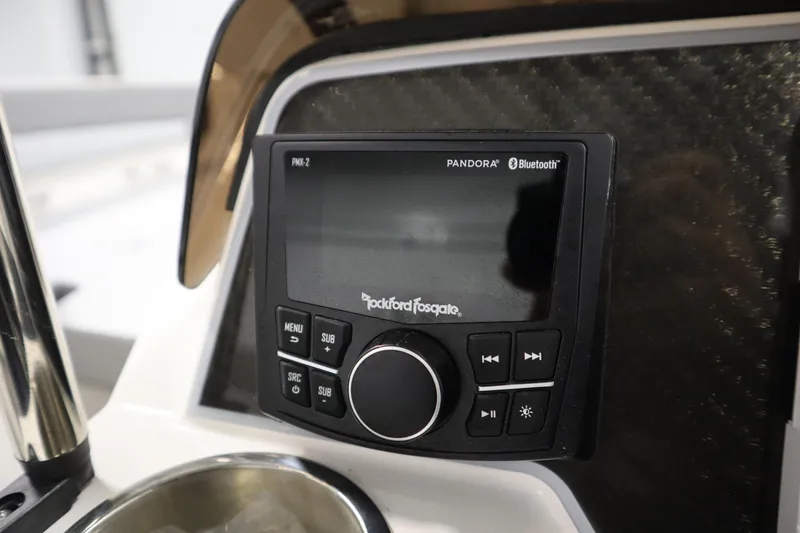 Slide: The Image of Rockford Fosgate audio system on 2025 Bayliner D22I boat dashboard with Bluetooth and Pandora features. - 13