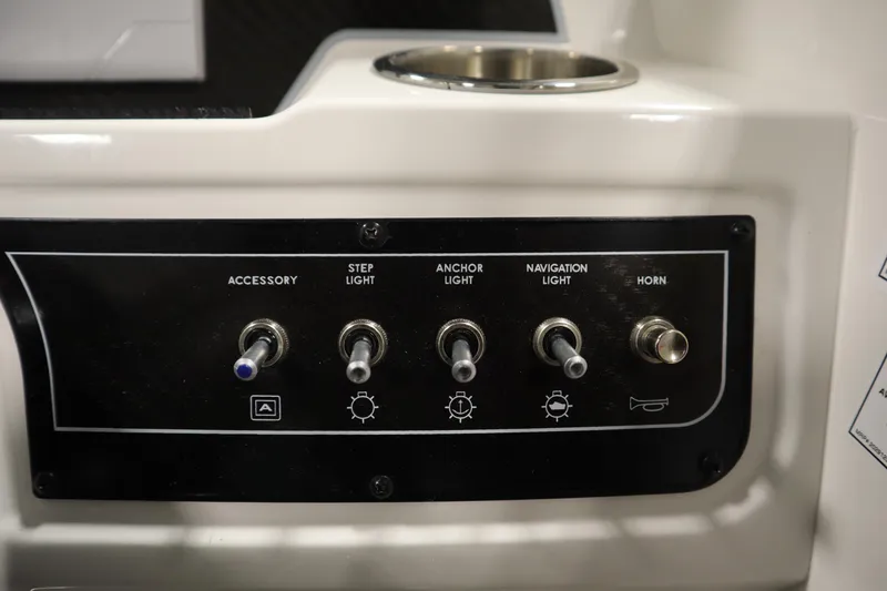 Slide: The Image of Control panel of 2025 Bayliner D22I boat with switches for lights and horn. - 17