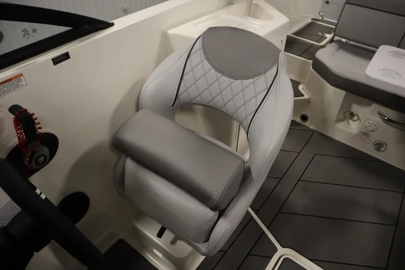 Slide: The Image of 2025 Bayliner D22I boat interior with modern seating and dashboard details. - 21