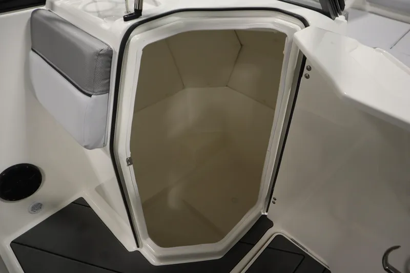 Slide: The Image of 2025 Bayliner D22I boat interior storage compartment with open door. - 23