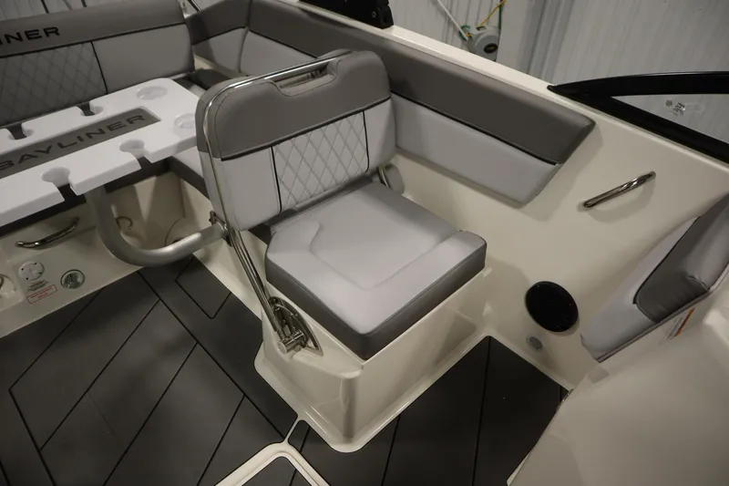 Slide: The Image of 2025 Bayliner D22I boat interior with gray seating and modern design. - 26