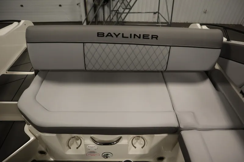 Slide: The Image of 2025 Bayliner D22I boat interior with cushioned seating and sleek design. - 32