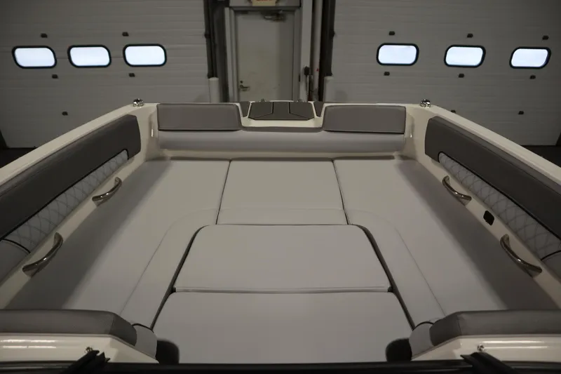 Slide: The Image of 2025 Bayliner D22I boat interior with cushioned seating and sleek design. - 4