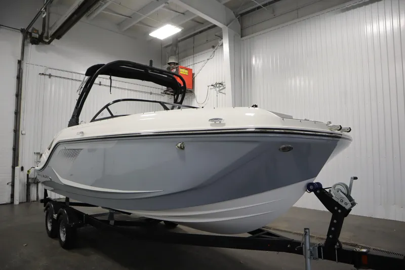 Slide: The Image of 2025 Bayliner D22I boat on trailer in indoor storage facility. - 49