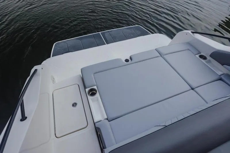 Slide: The Image of 2025 Bayliner D22I boat with spacious seating and sleek design on calm water. - 62