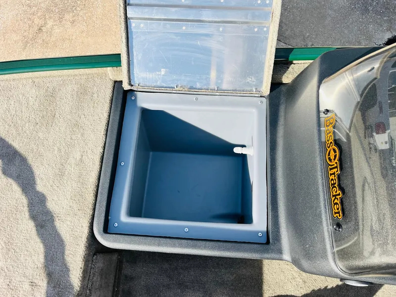 Slide: The Image of Open storage compartment in 2026 Tracker Bass Tracker Classic Limited boat. - 13
