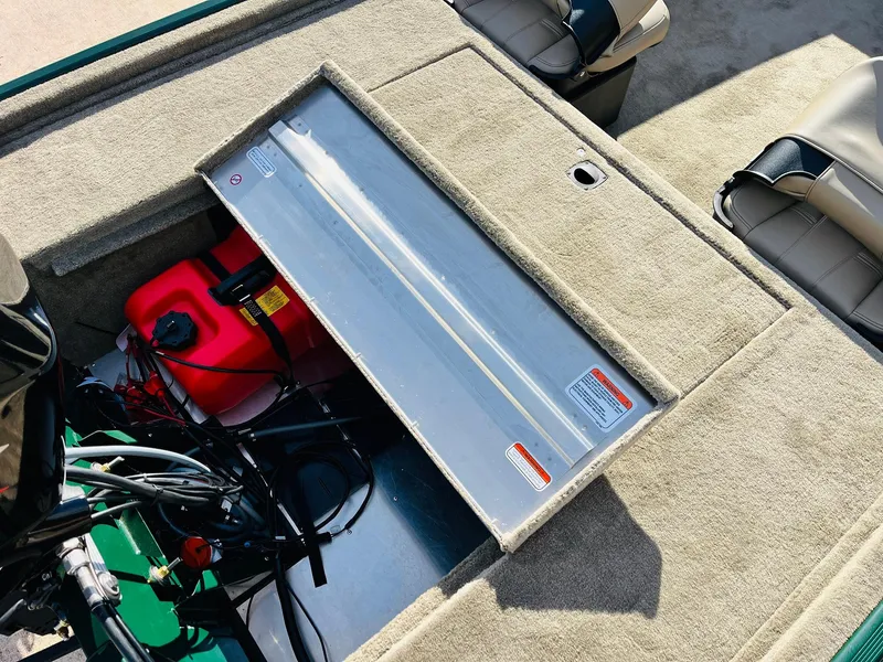 Slide: The Image of Interior view of 2026 Tracker Bass Tracker Classic Limited boat, showing storage compartment and seating. - 37