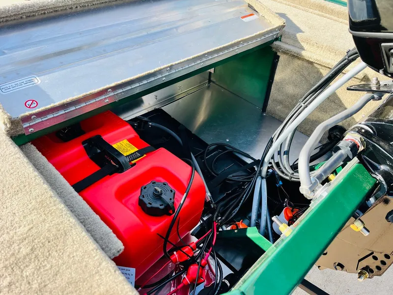 Slide: The Image of 2026 Tracker Bass Tracker Classic Limited boat engine compartment with red fuel tank. - 38
