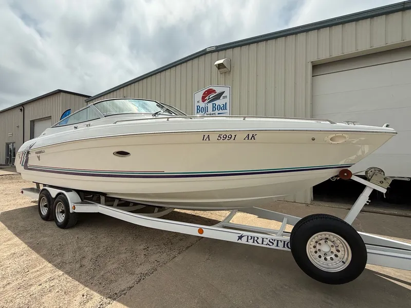 Slide: The Image of 1997 Formula 280SS boat on trailer outside Boji Boat building. - 1