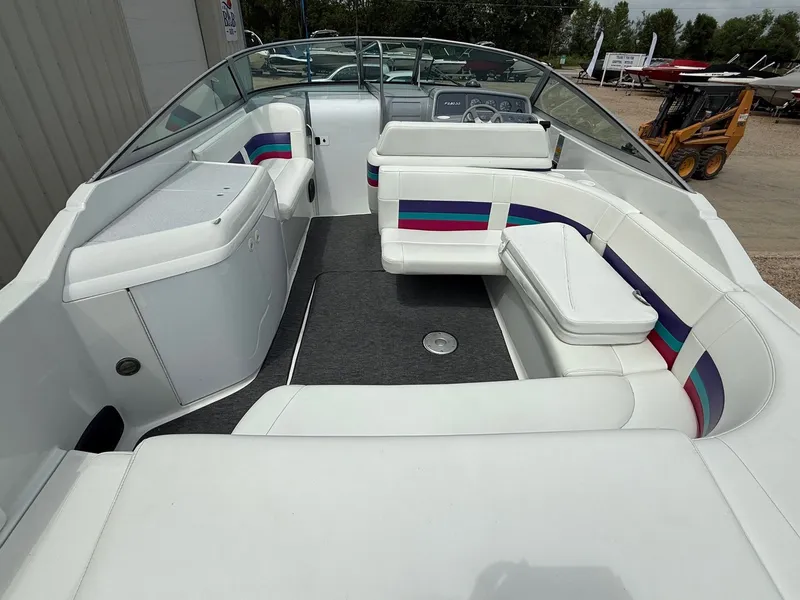 Slide: The Image of 1997 Formula 280SS boat interior with white seating and colorful accents. - 13