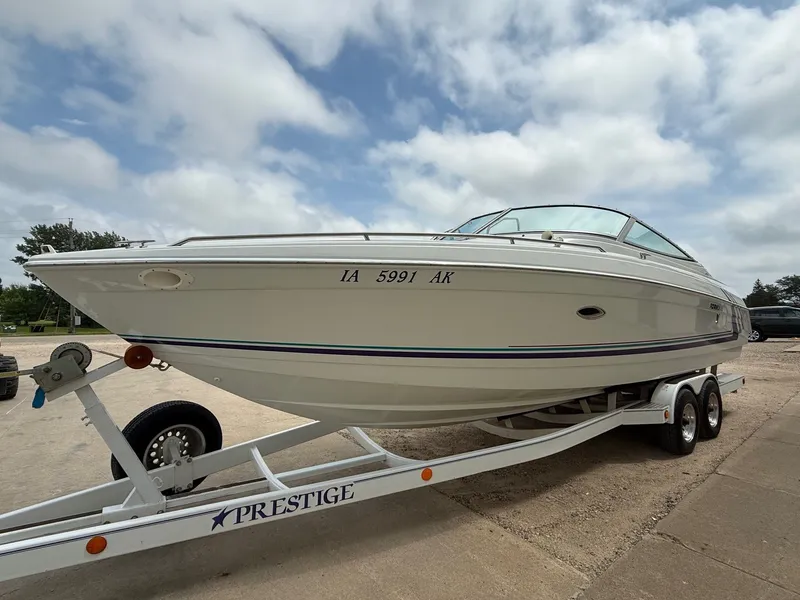 Slide: The Image of 1997 Formula 280SS boat on trailer under cloudy sky. - 2