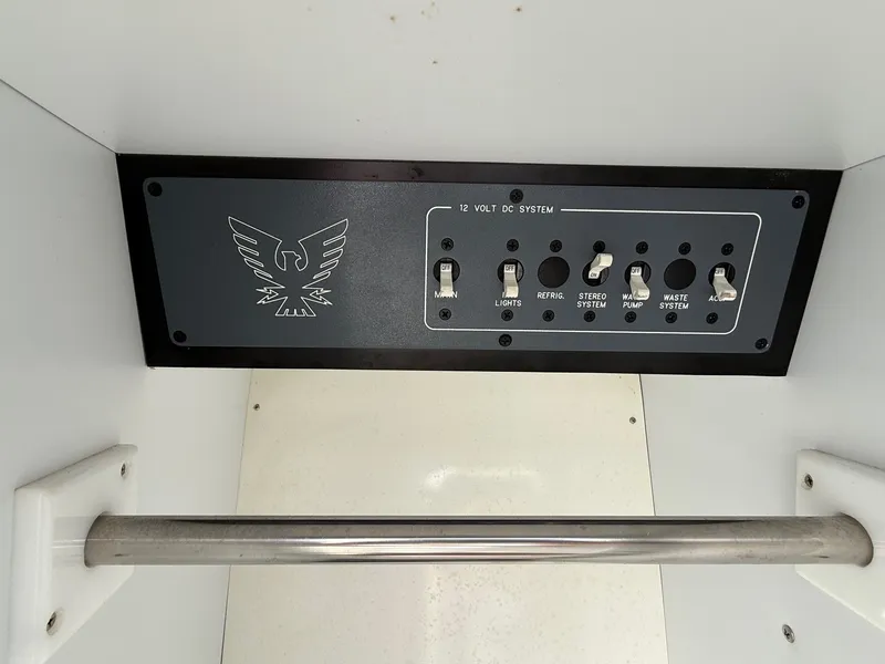 Slide: The Image of Control panel of a 1997 Formula 280SS boat with switches for various systems. - 20