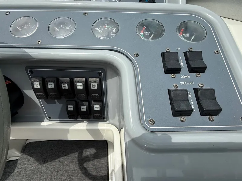 Slide: The Image of 1997 Formula 280SS boat dashboard with gauges and control switches. - 24
