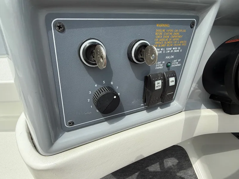 Slide: The Image of Control panel of a 1997 Formula 280SS boat with ignition keys and switches. - 25