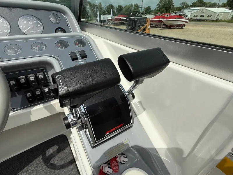 Slide: The Image of Control panel of a 1997 Formula 280SS boat with Mercury throttle levers. - 26