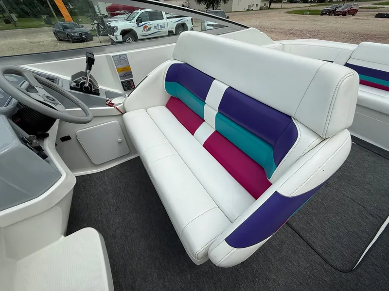 Slide: The Image of 1997 Formula 280SS boat interior with colorful seating and steering wheel. - 29