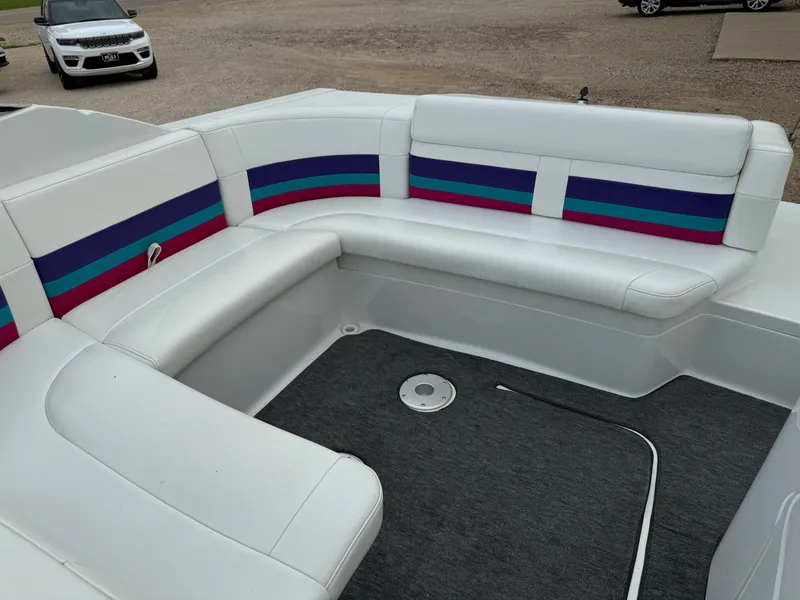 Slide: The Image of 1997 Formula 280SS boat interior with white seating and colorful stripes. - 31