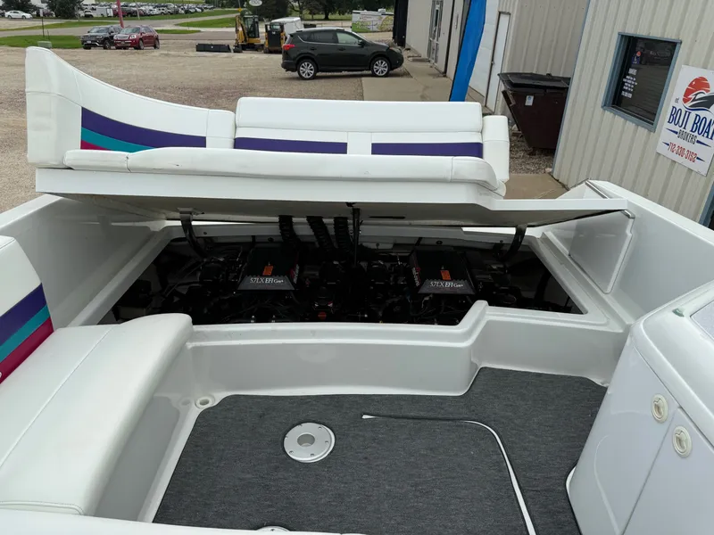 Slide: The Image of 1997 Formula 280SS boat with open engine compartment, showcasing dual engines. - 36