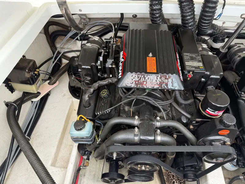 Slide: The Image of Engine compartment of a 1997 Formula 280SS boat, showcasing detailed mechanical components. - 38