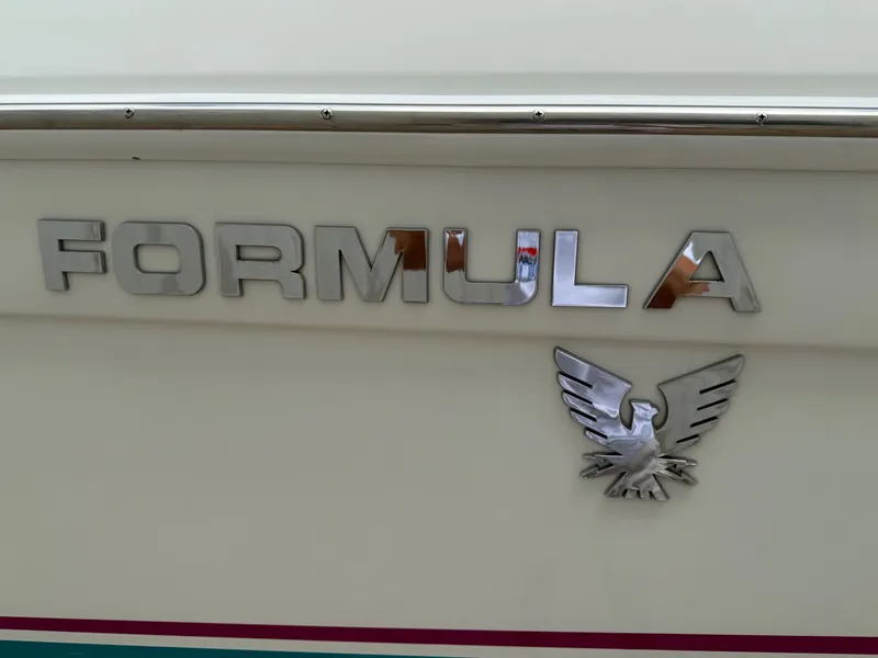 Slide: The Image of 1997 Formula 280SS boat emblem with eagle logo on white background. - 4