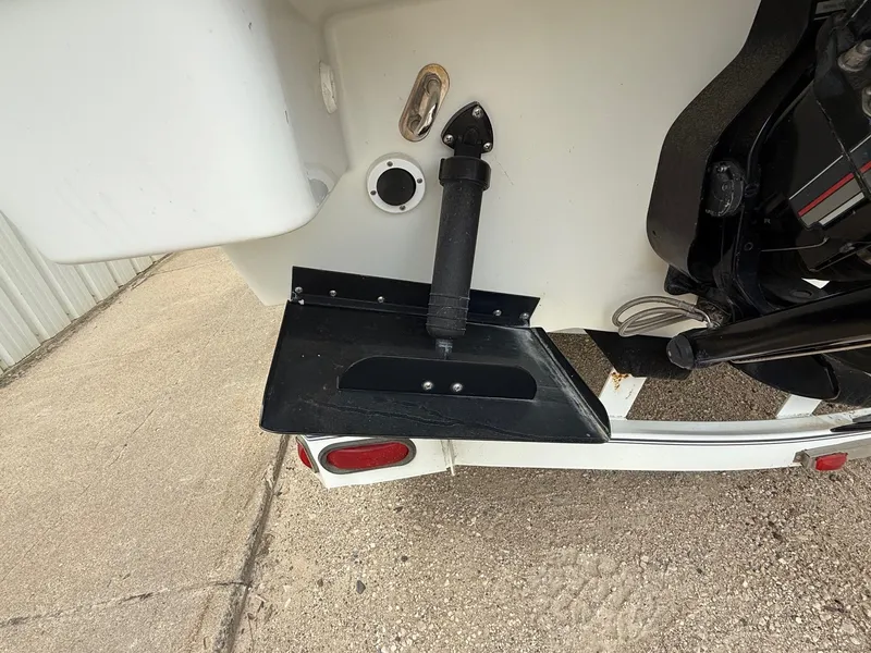 Slide: The Image of 1997 Formula 280SS boat stern with trim tab and outdrive components. - 8