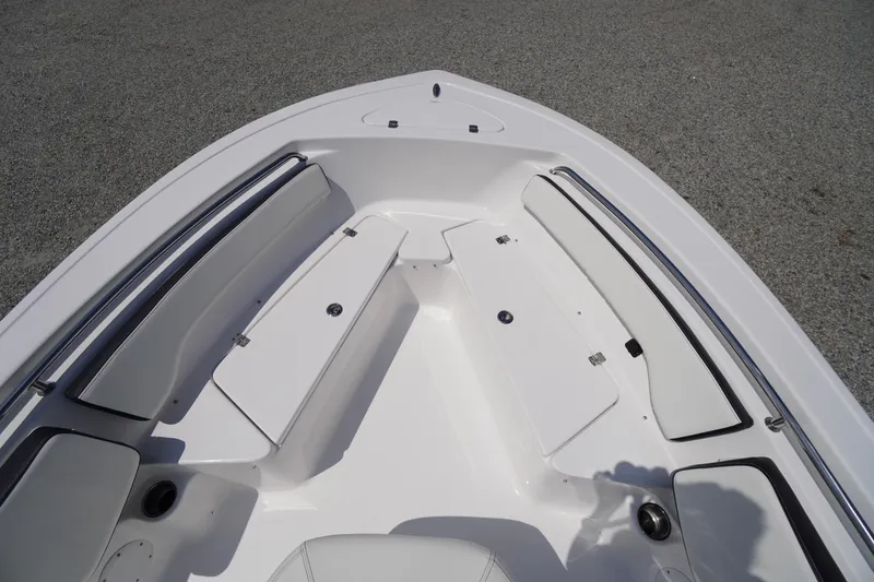 Slide: The Image of 2025 Tidewater 198 CC Adventure boat interior with cushioned seating and storage compartments. - 10