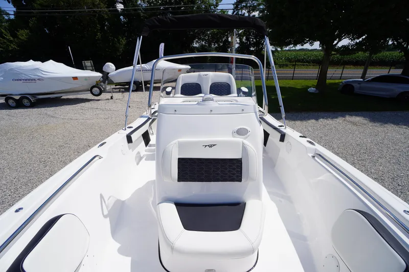 Slide: The Image of 2025 Tidewater 198 CC Adventure boat interior with seating and steering console. - 15